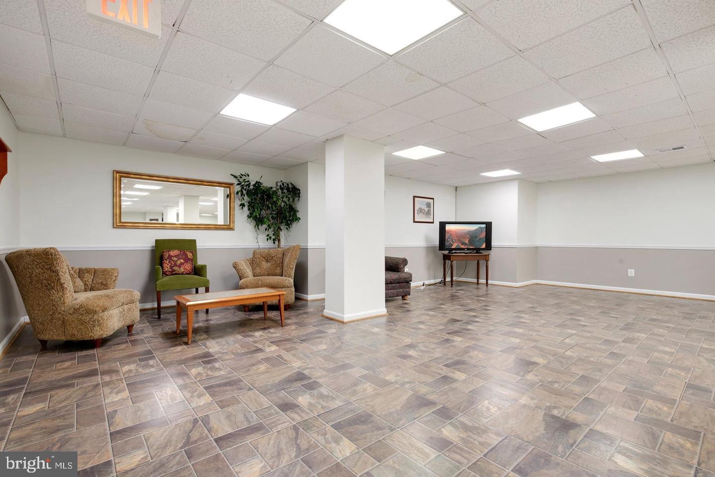 4 Monroe Street, Unit 802 Rockville, MD 20850 - Photo 31 of 44 a living room with furniture and a table
