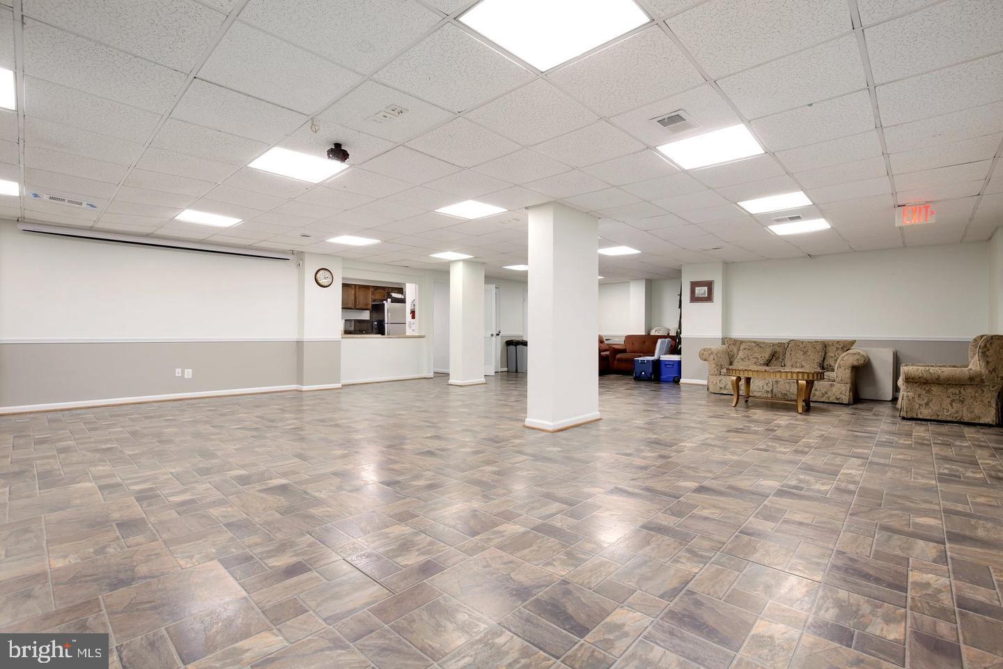 4 Monroe Street, Unit 802 Rockville, MD 20850 - Photo 32 of 44 a view of a living room a kitchen and a stove