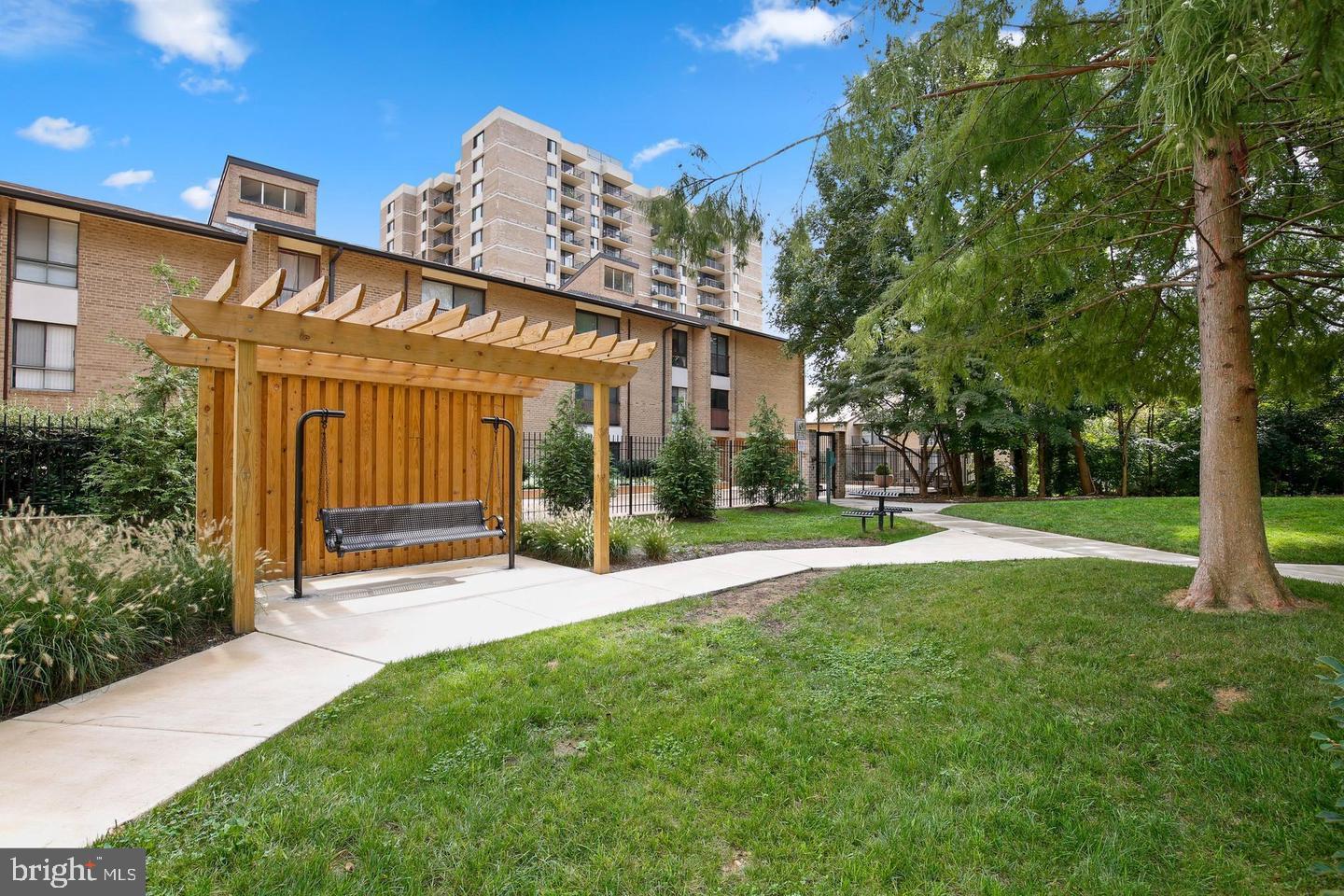 4 Monroe Street, Unit 802 Rockville, MD 20850 - Photo 34 of 44 a view of a house with a yard and sitting area