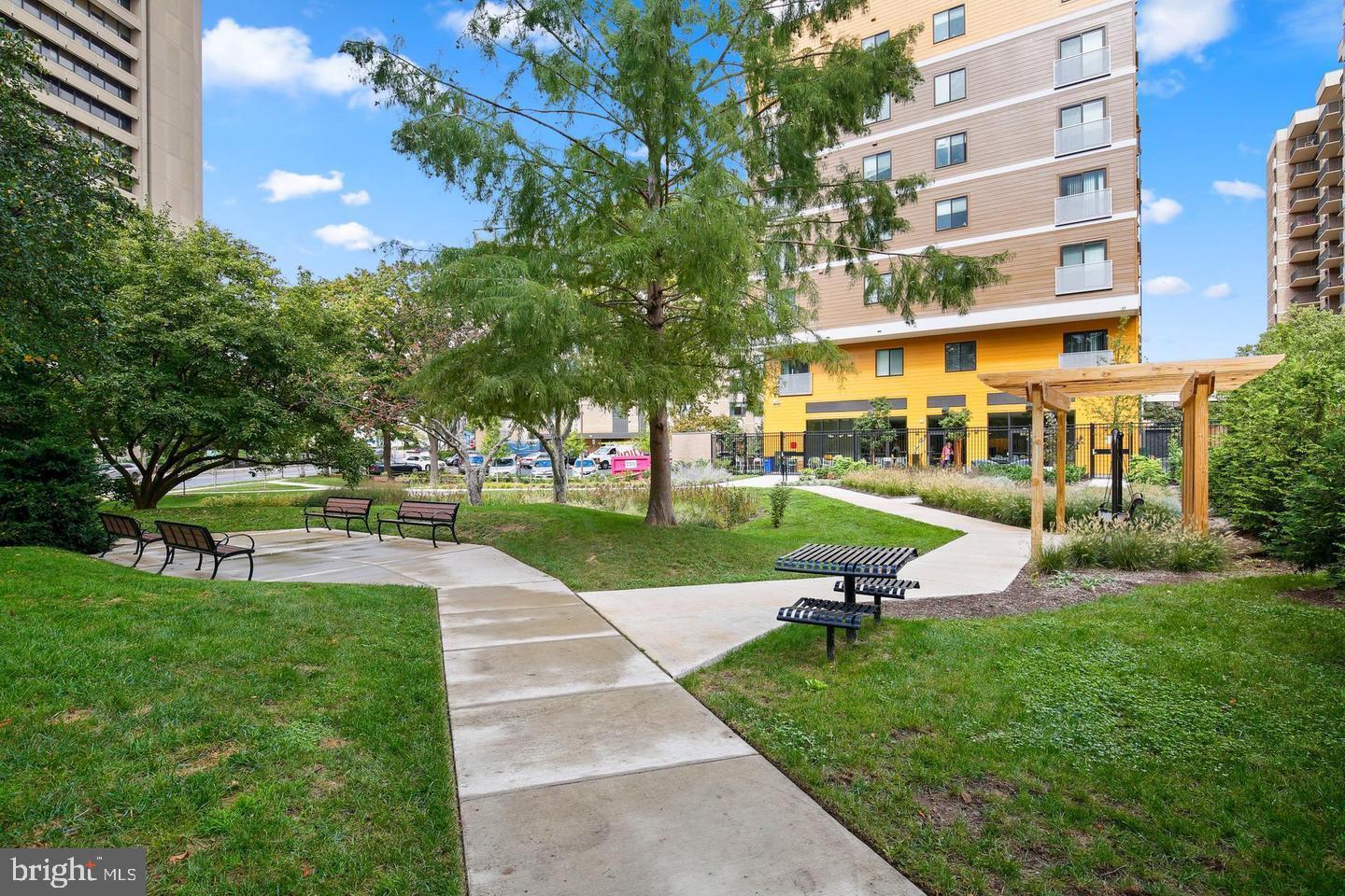 4 Monroe Street, Unit 802 Rockville, MD 20850 - Photo 35 of 44 a view of a building with a yard