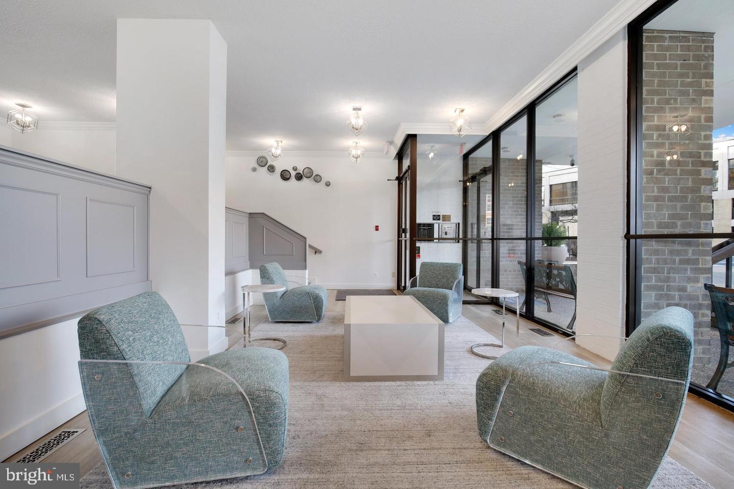4 Monroe Street, Unit 802 Rockville, MD 20850 - Photo 4 of 44 a living room with furniture and a fireplace