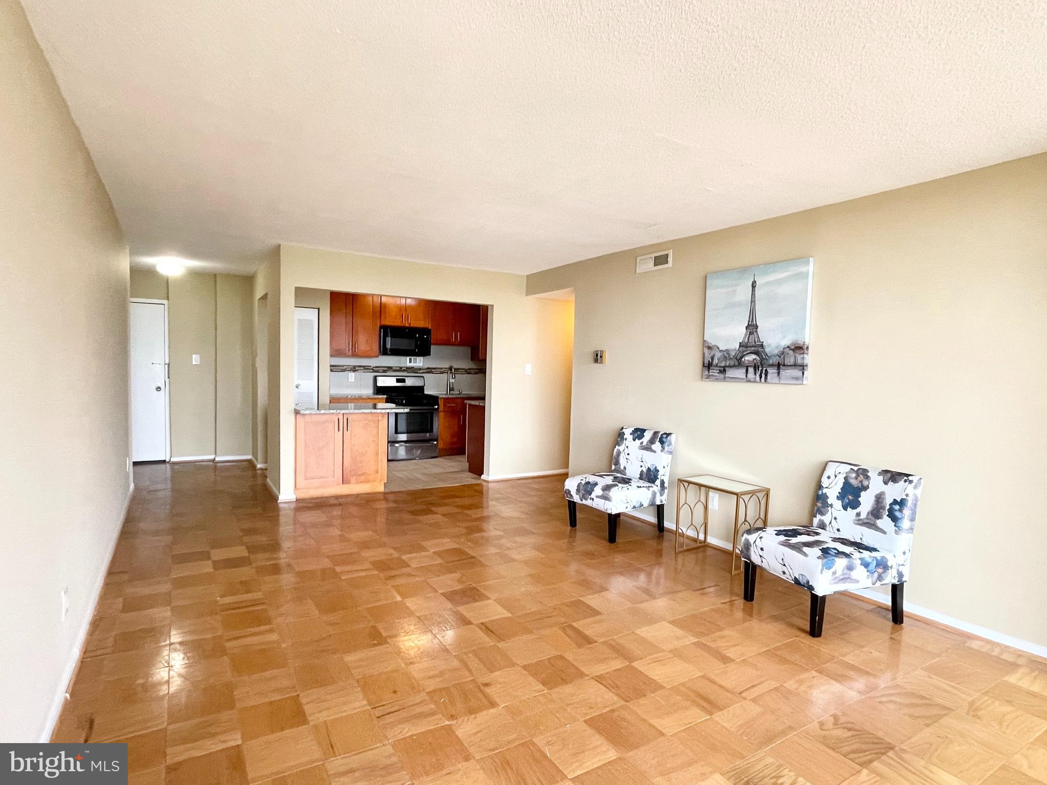 4 Monroe Street, Unit 802 Rockville, MD 20850 - Photo 7 of 44 a living room with furniture and kitchen view