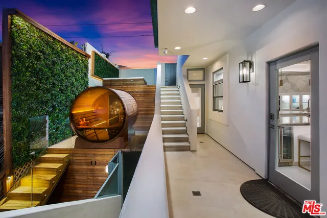 a view of stairs and wooden floor