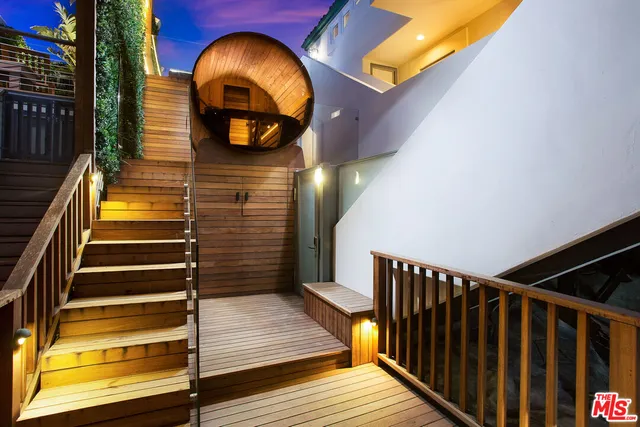 a view of balcony with wooden floor