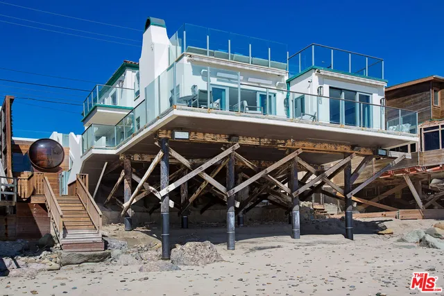 a view of a terrace with couches and potted plants