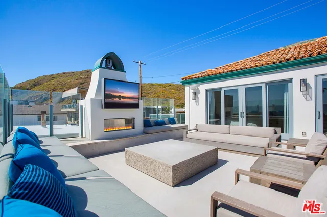 a view of a terrace with furniture and outdoor seating