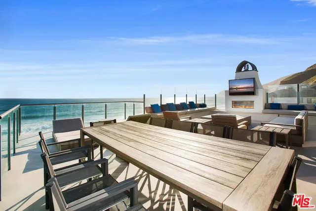 a balcony with furniture and view of balcony