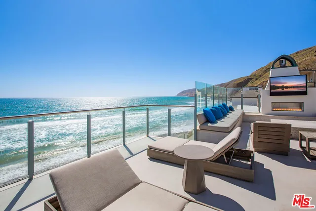 a bedroom with furniture and wooden floor