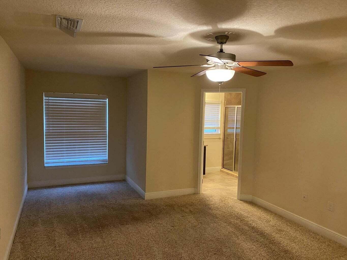 5910 Northwest Java Court Port St. Lucie, FL 34986 - Photo 8 of 16 a view of an empty room with a window