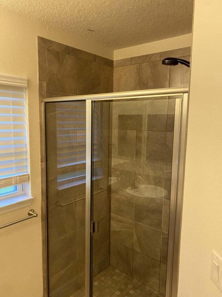 5910 Northwest Java Court Port St. Lucie, FL 34986 - Photo 10 of 16 a bathroom with a shower