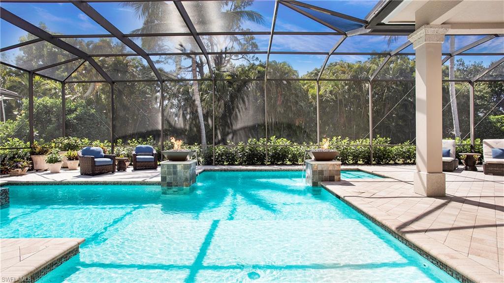 a view of a backyard with sitting area