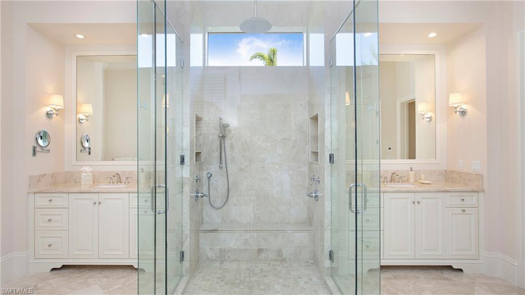 645 Rudder Road Naples, FL 34102 - Photo 23 of 45 a bathroom with a shower and a sink