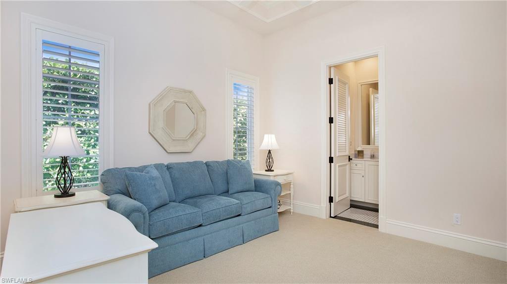 645 Rudder Road Naples, FL 34102 - Photo 28 of 45 a living room with furniture and a window