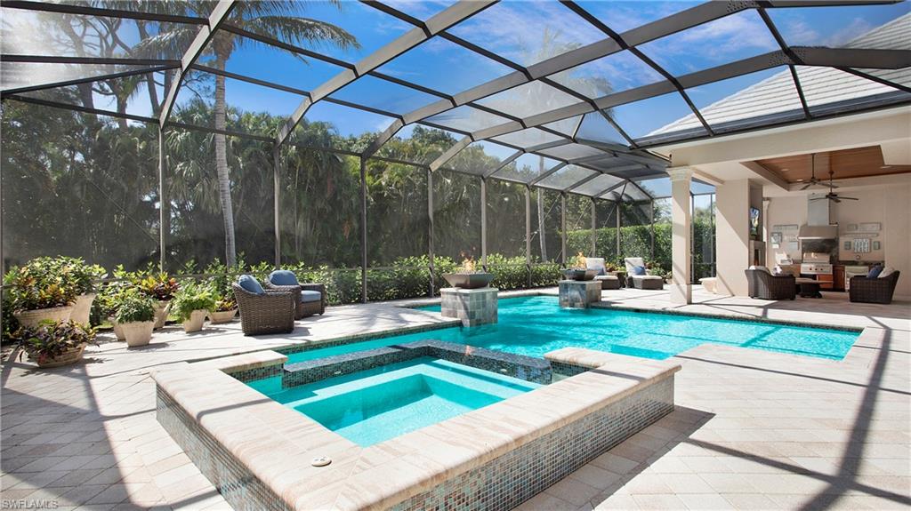 645 Rudder Road Naples, FL 34102 - Photo 38 of 45 a view of a backyard with sitting area