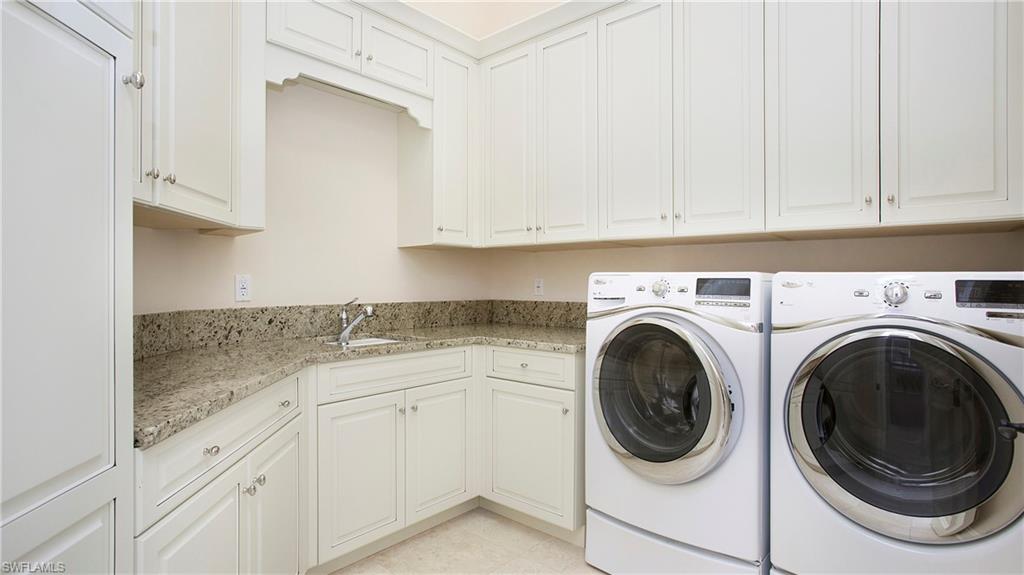 645 Rudder Road Naples, FL 34102 - Photo 43 of 45 a utility room with sink dryer and washer