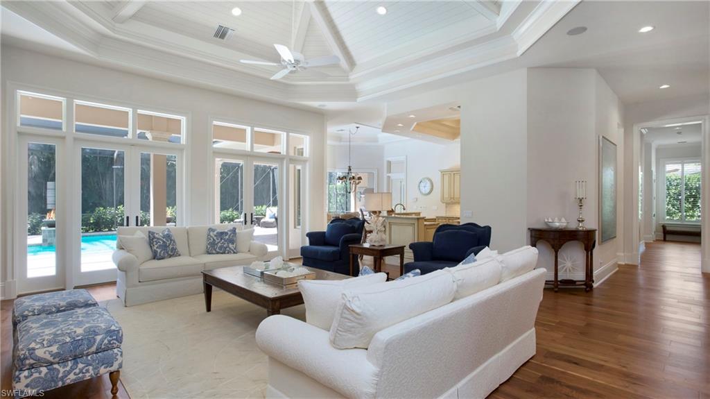 645 Rudder Road Naples, FL 34102 - Photo 7 of 45 a living room with furniture and a large window