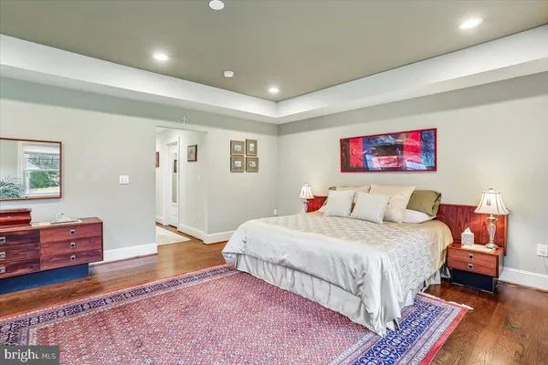 a living room with furniture and view of kitchen