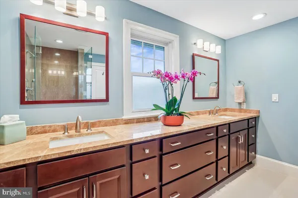 a bedroom with furniture and a flat screen tv