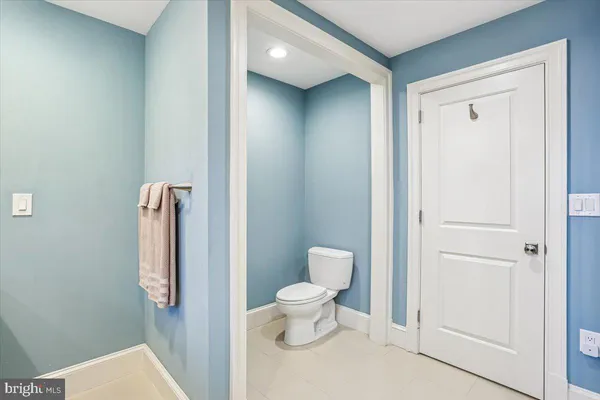 a bedroom with a bed and a lamp