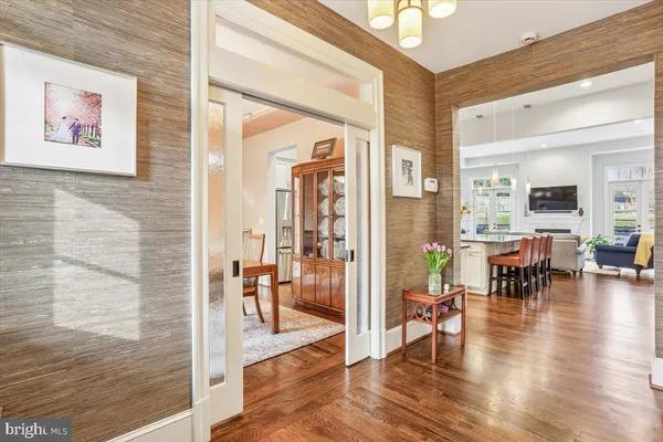 a kitchen with stainless steel appliances granite countertop a sink counter space and wooden floor