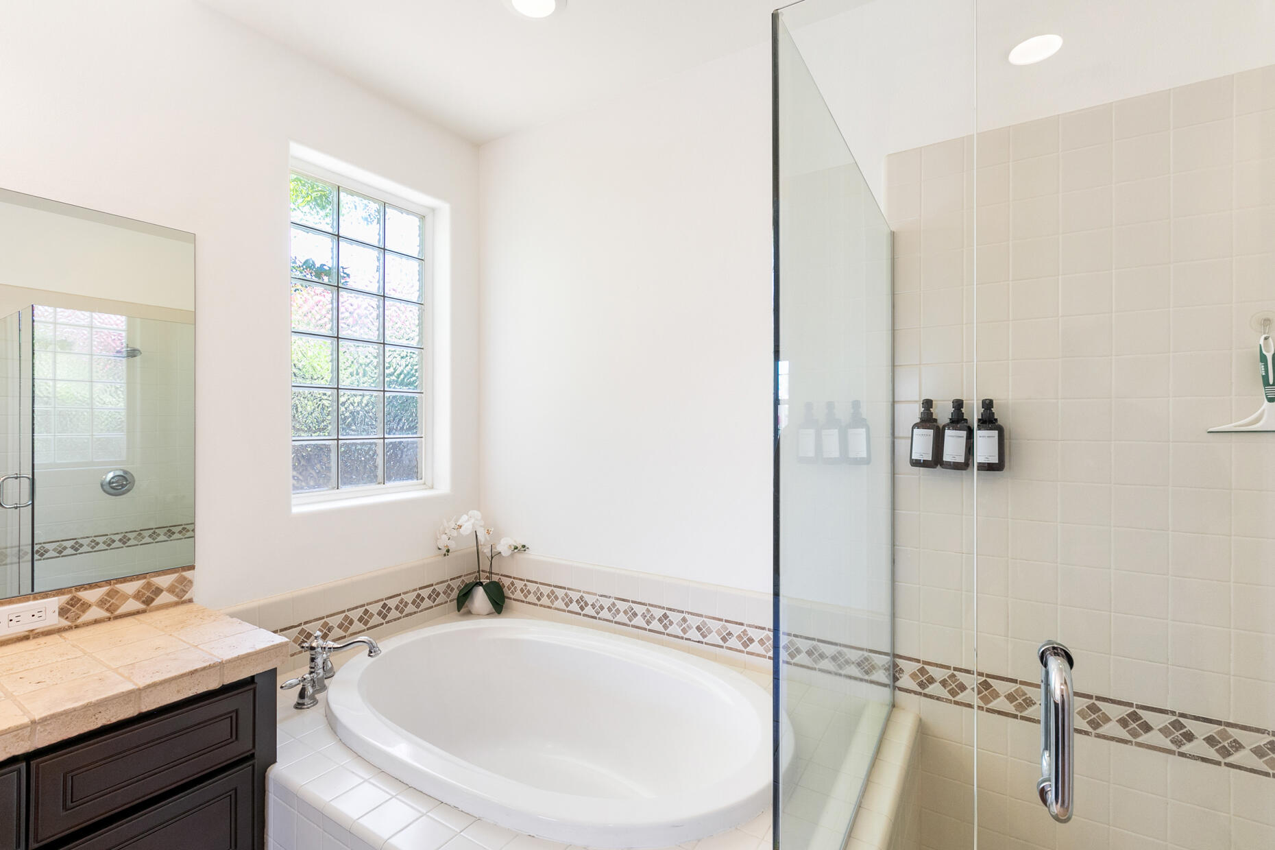 80919 Via Puerta Azul La Quinta, CA 92253 - Photo 11 of 32 a bathroom with a tub sink and mirror