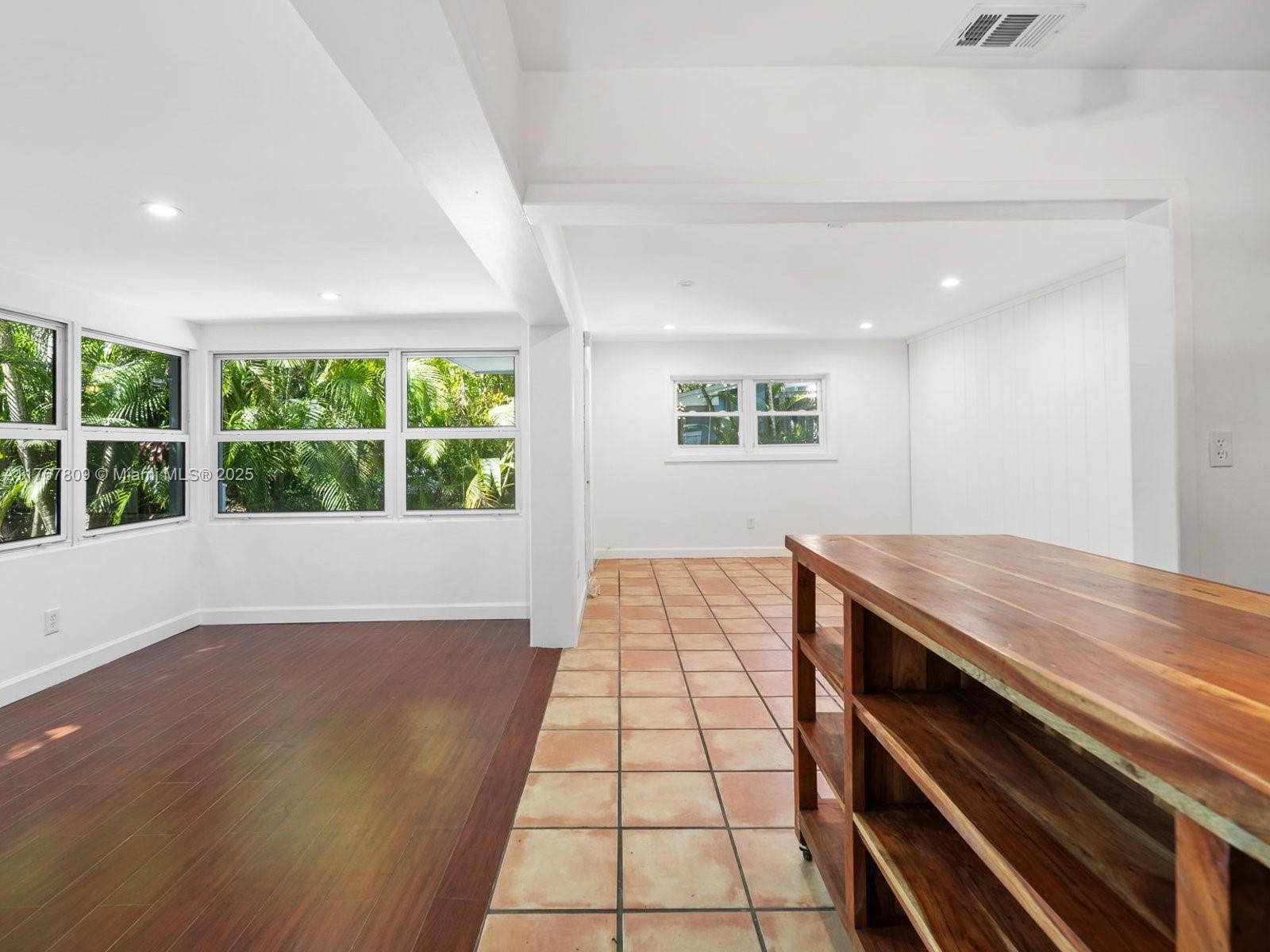 3631 Loquat Avenue Miami, FL 33133 - Photo 12 of 31 a view of a room with wooden floor and window
