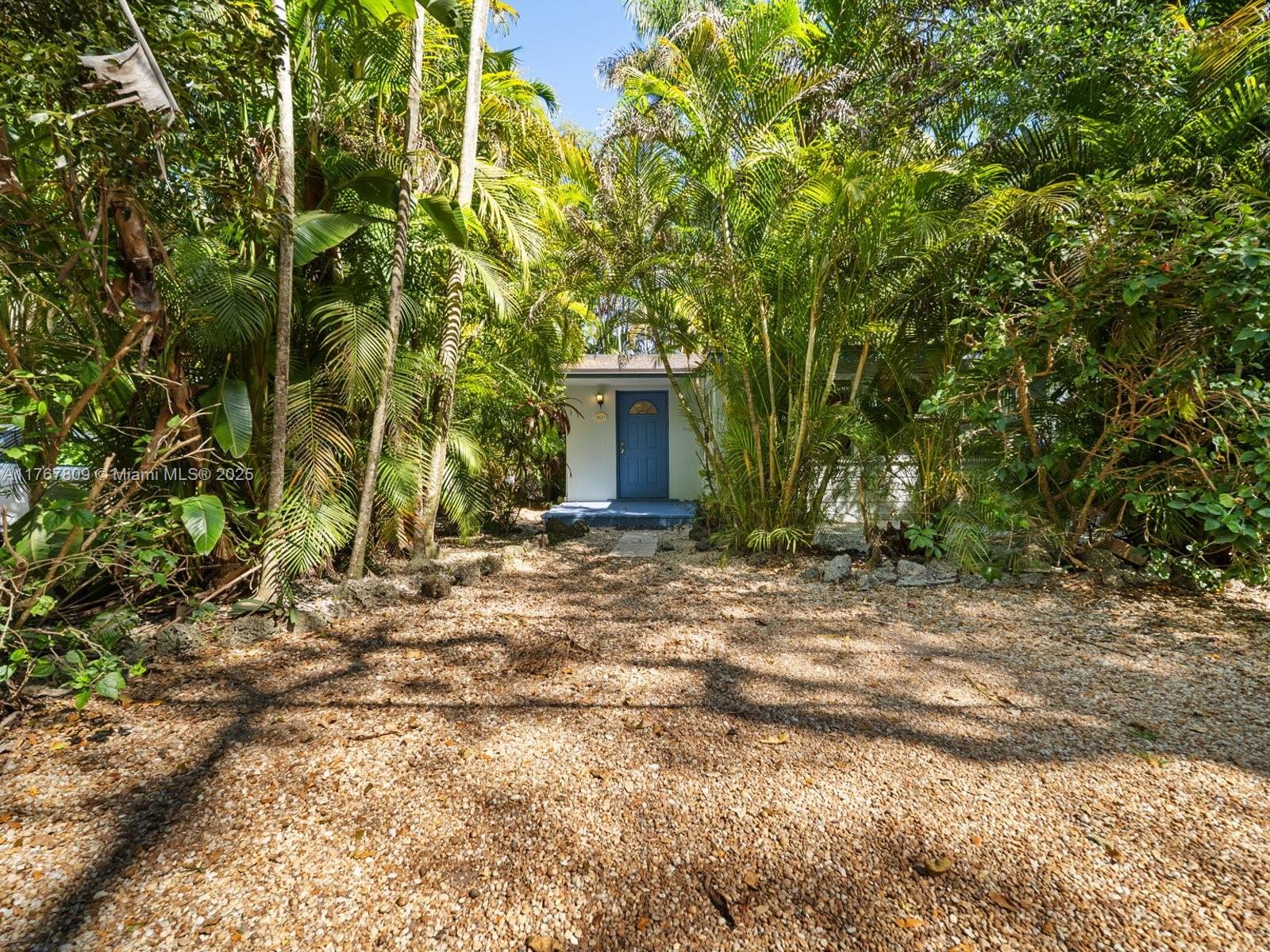 3631 Loquat Avenue Miami, FL 33133 - Photo 2 of 31 a view of a house with a yard