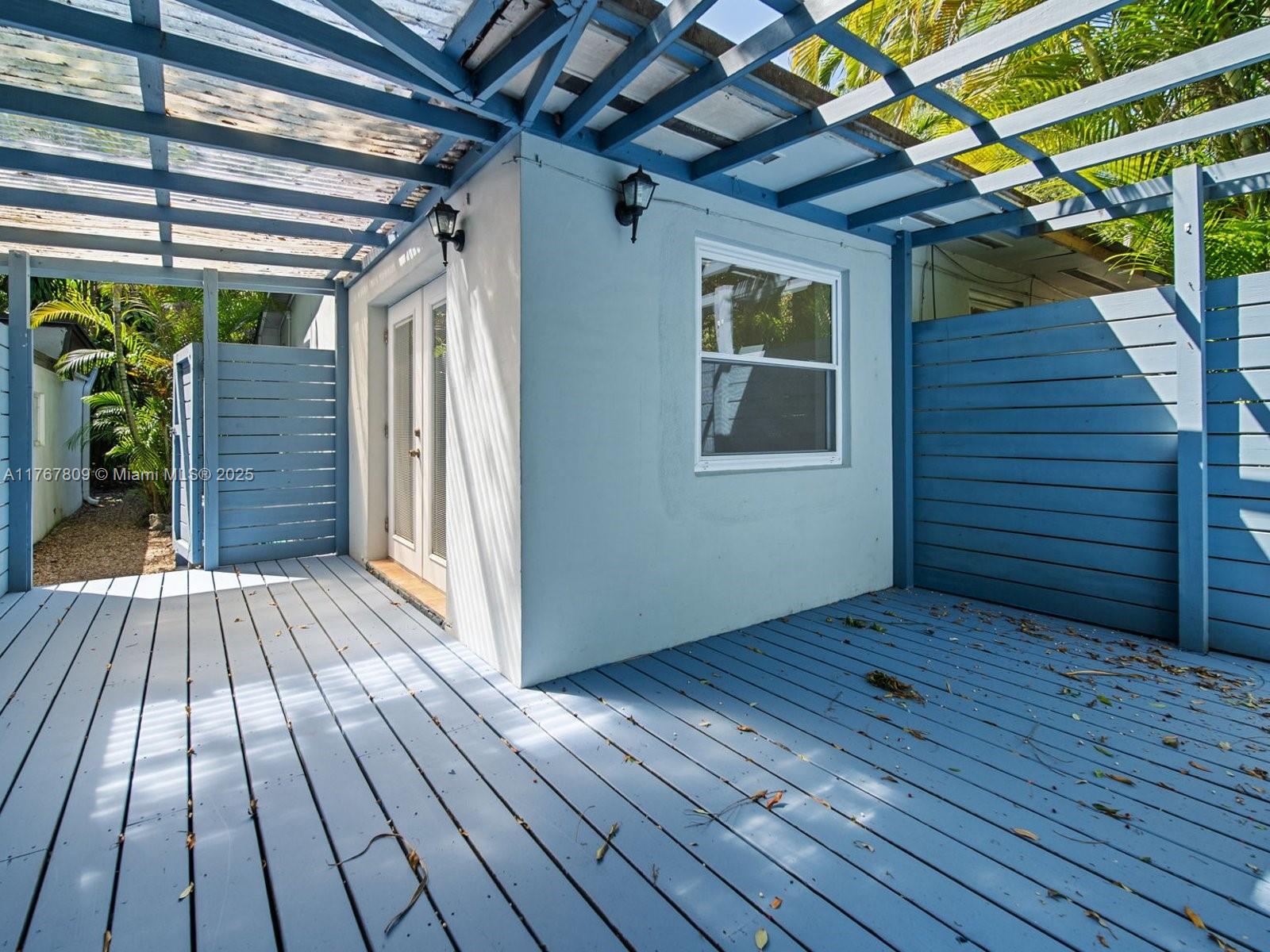 3631 Loquat Avenue Miami, FL 33133 - Photo 26 of 31 a view of an empty room with wooden floor