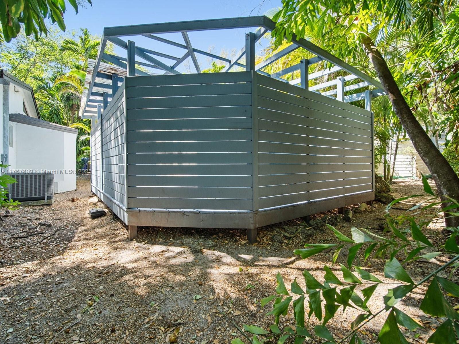 3631 Loquat Avenue Miami, FL 33133 - Photo 27 of 31 a view of a house with a yard