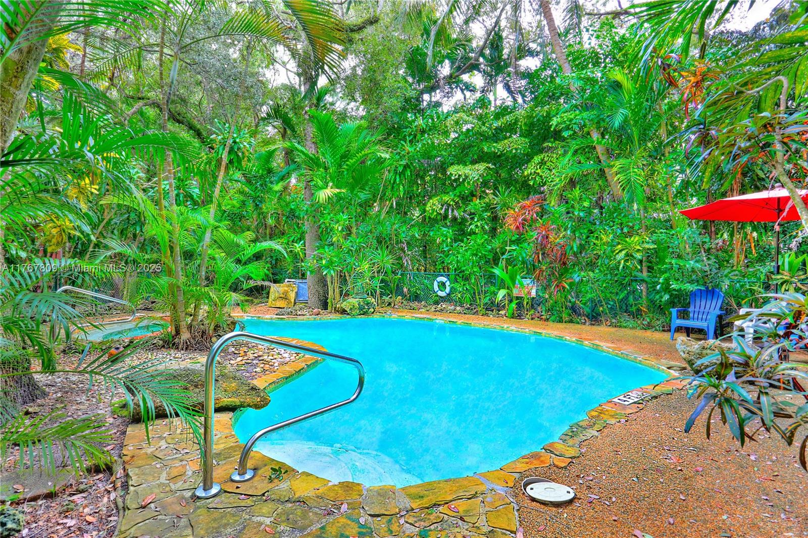3631 Loquat Avenue Miami, FL 33133 - Photo 30 of 31 a view of a swimming pool with an outdoor seating