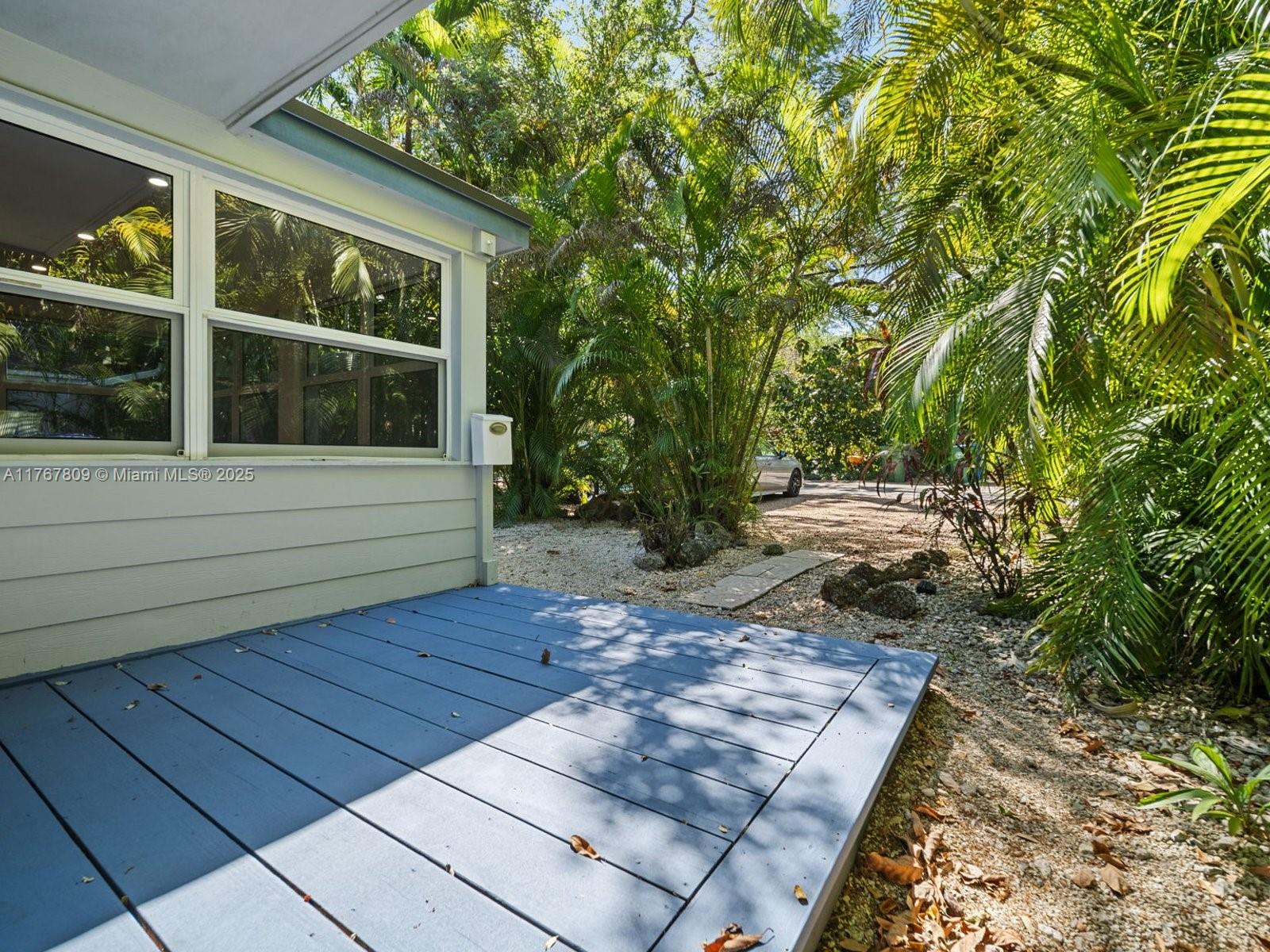 3631 Loquat Avenue Miami, FL 33133 - Photo 3 of 31 a view of a backyard with sitting area