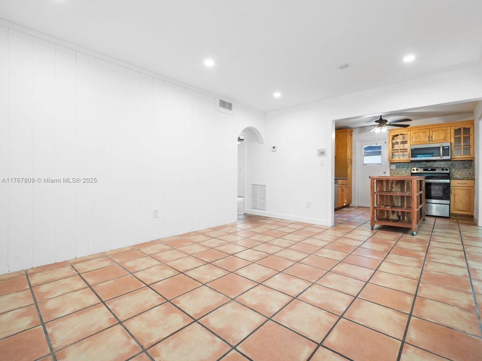 3631 Loquat Avenue Miami, FL 33133 - Photo 7 of 31 a view of kitchen with furniture and window