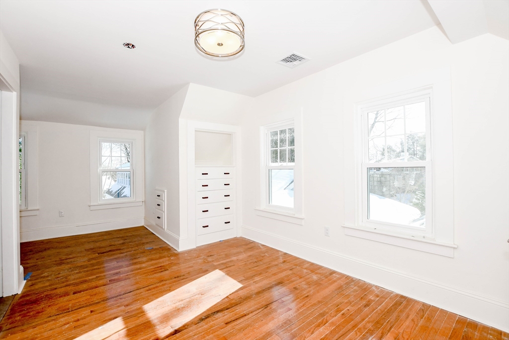 3 Pleasant Street Marion, MA 02738 - Photo 11 of 14 a bedroom with a bed and a window