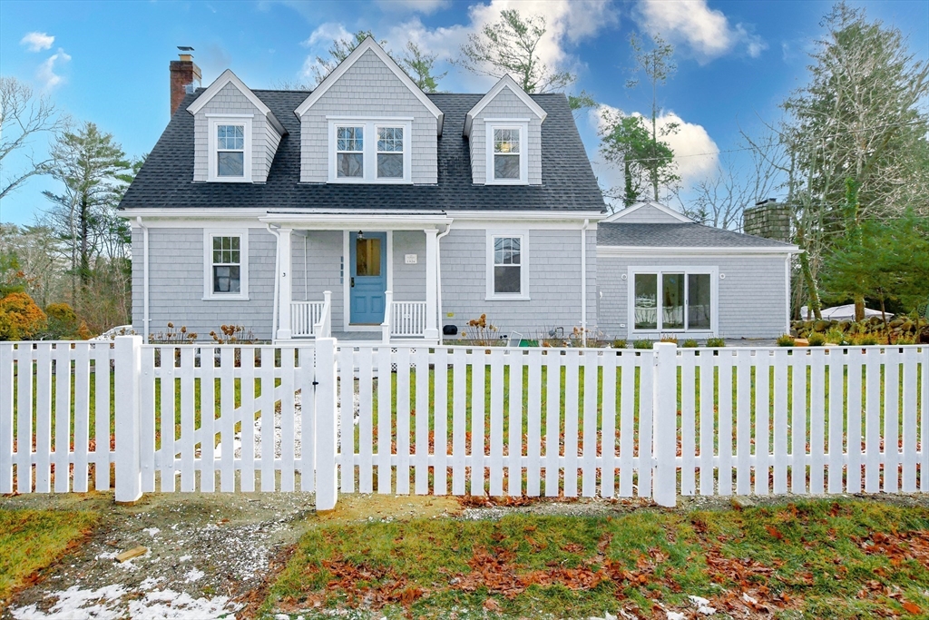 3 Pleasant Street Marion, MA 02738 - Photo 2 of 14 a front view of a house with a garden