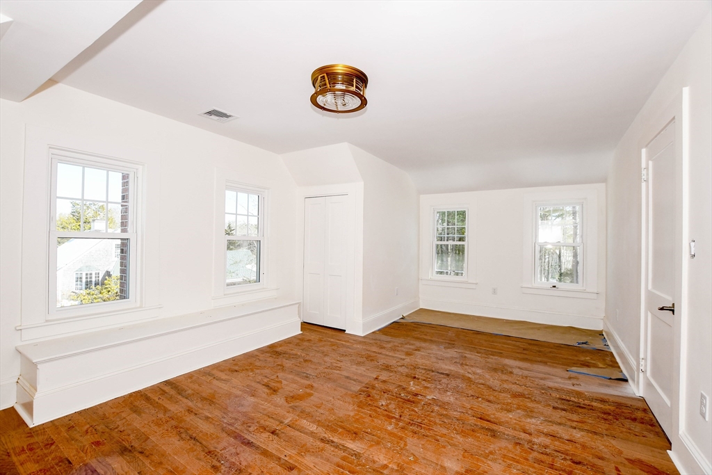 3 Pleasant Street Marion, MA 02738 - Photo 8 of 14 a view of empty room with window and wooden floor