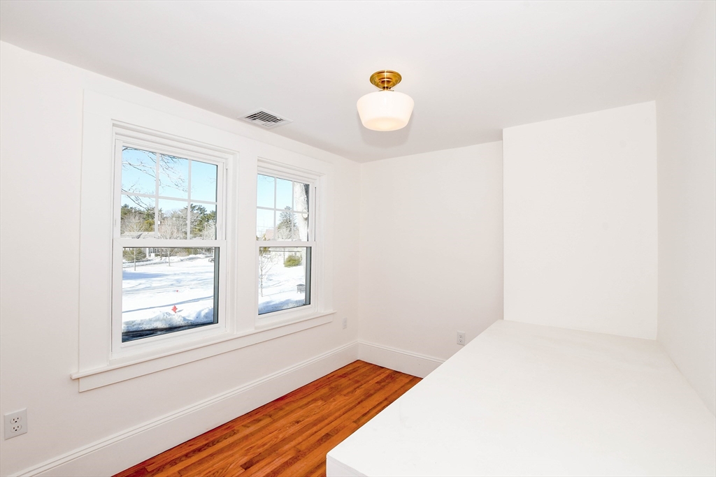 3 Pleasant Street Marion, MA 02738 - Photo 9 of 14 a bedroom with a bed and window