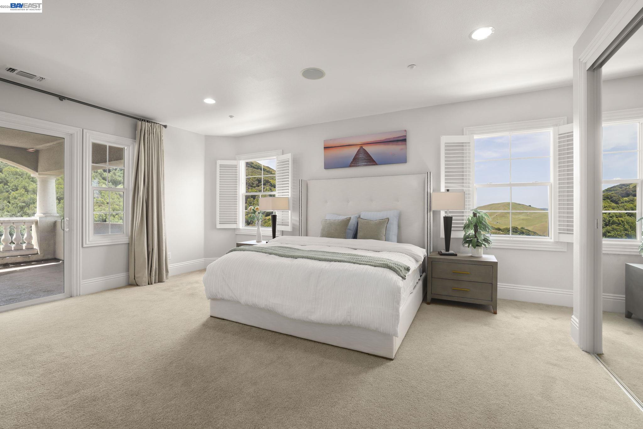 950 Winsford Court San Ramon, CA 94583 - Photo 49 of 68 a spacious bedroom with a large bed and a large window