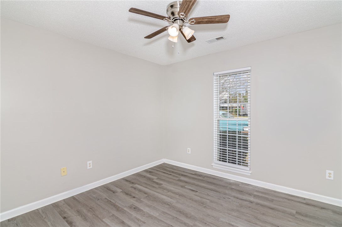 102 Hawk Ridge Drive Anderson, SC 29621 - Photo 12 of 38 This serene bedroom offers ample light and modern flooring, creating a peaceful retreat.