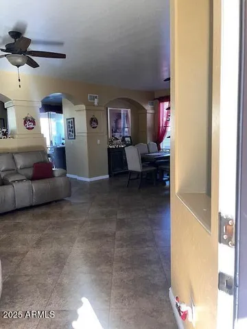 a living room with furniture and a window