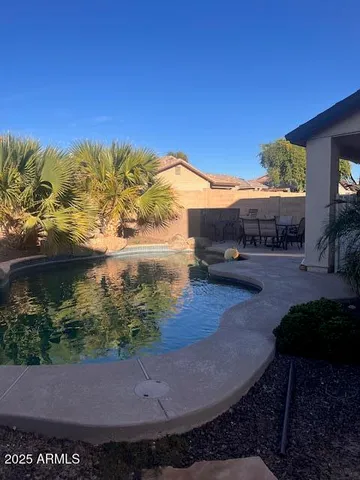 a view of a swimming pool with an outdoor space