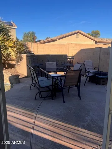 a view of a terrace with furniture