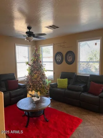 a living room with furniture and a window