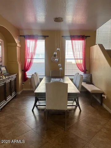 a living room with furniture a window and a table