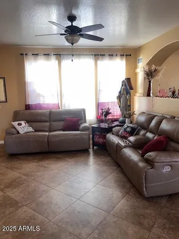 a living room with furniture and a window