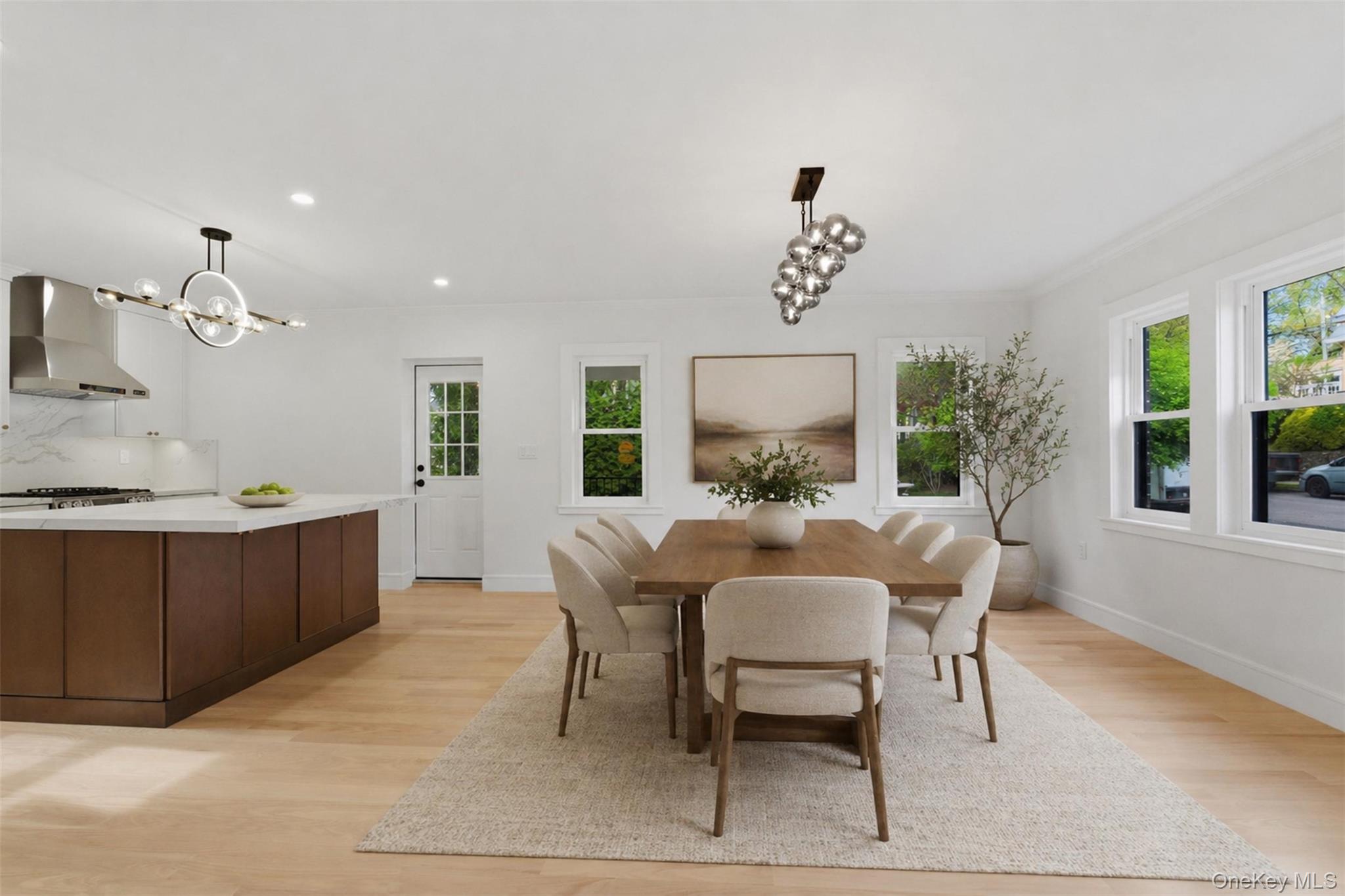 40 Calhoun Avenue New Rochelle, NY 10801 - Photo 4 of 49 Open-concept living space with light wood-finish flooring