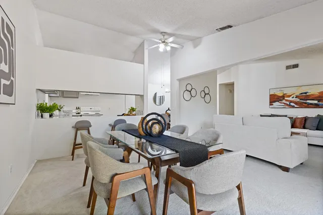 a workspace with furniture and chandelier