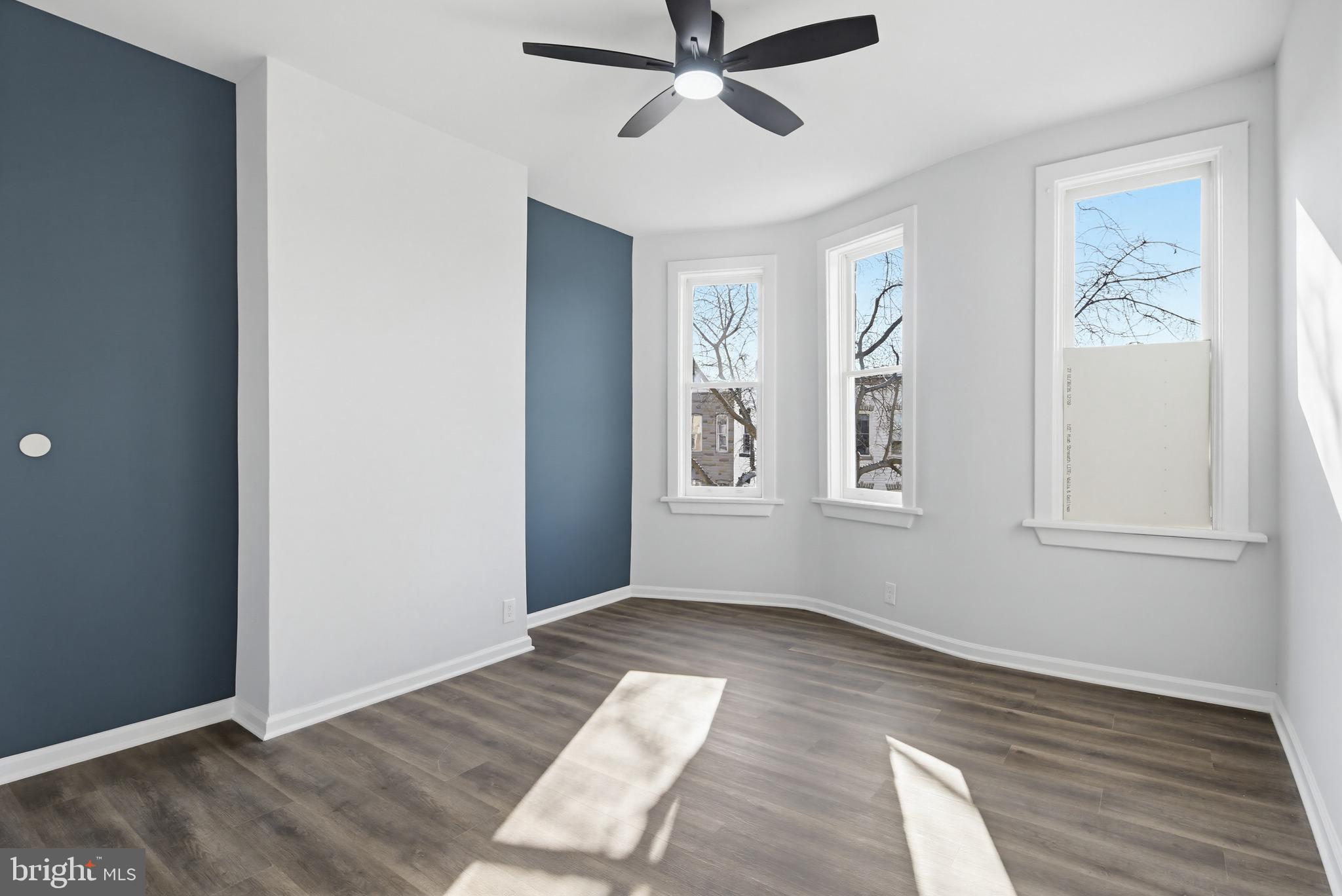 1244 Carroll Street Baltimore, MD 21230 - Photo 12 of 30 a view of empty room with wooden floor and fan