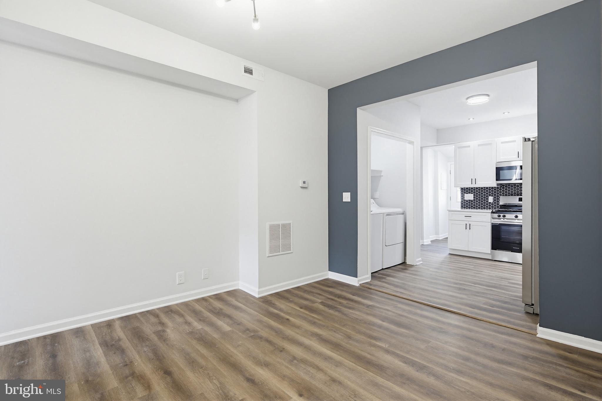 1244 Carroll Street Baltimore, MD 21230 - Photo 23 of 30 a view of empty room with wooden floor