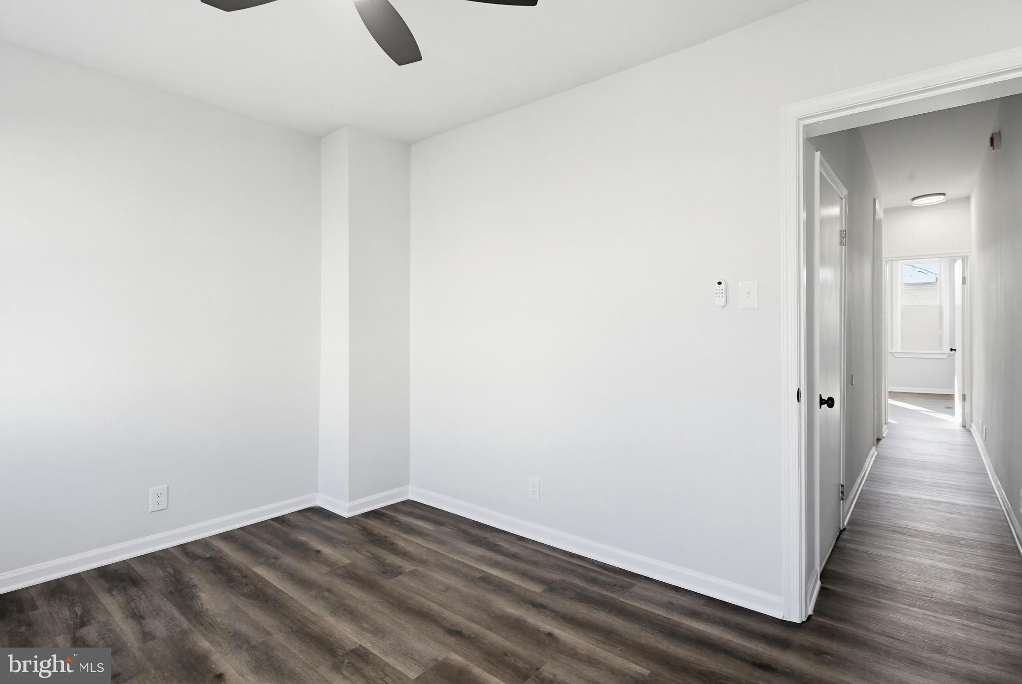 1244 Carroll Street Baltimore, MD 21230 - Photo 5 of 30 a view of an empty room with wooden floor