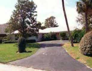 17 Island Road Sewall's Point, FL 34996 - Photo 1 of 1 a view of a garden with a tree